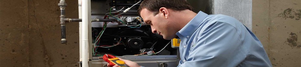 Tech working on a furnace