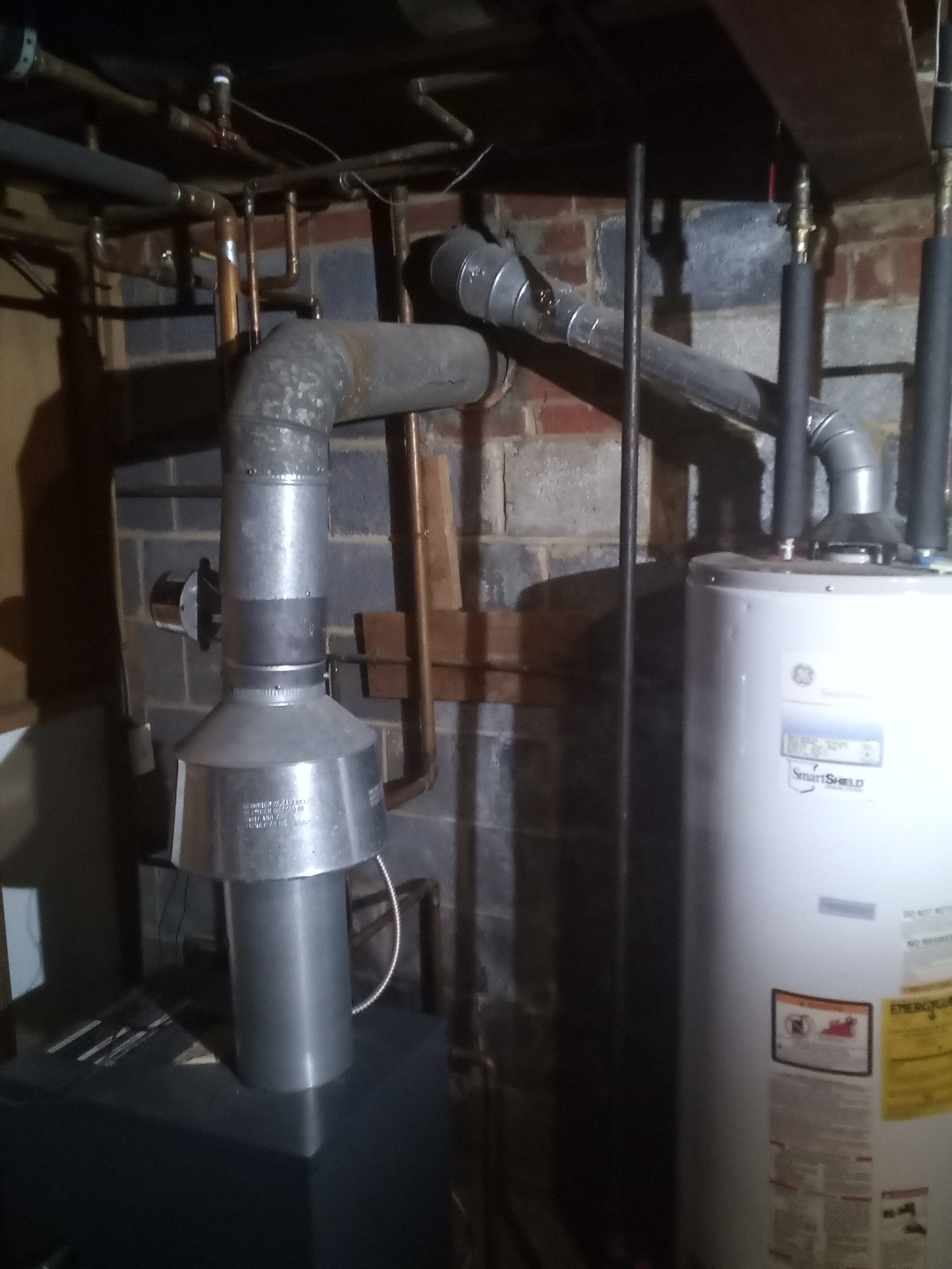 Technician inspecting a residential heating and cooling system